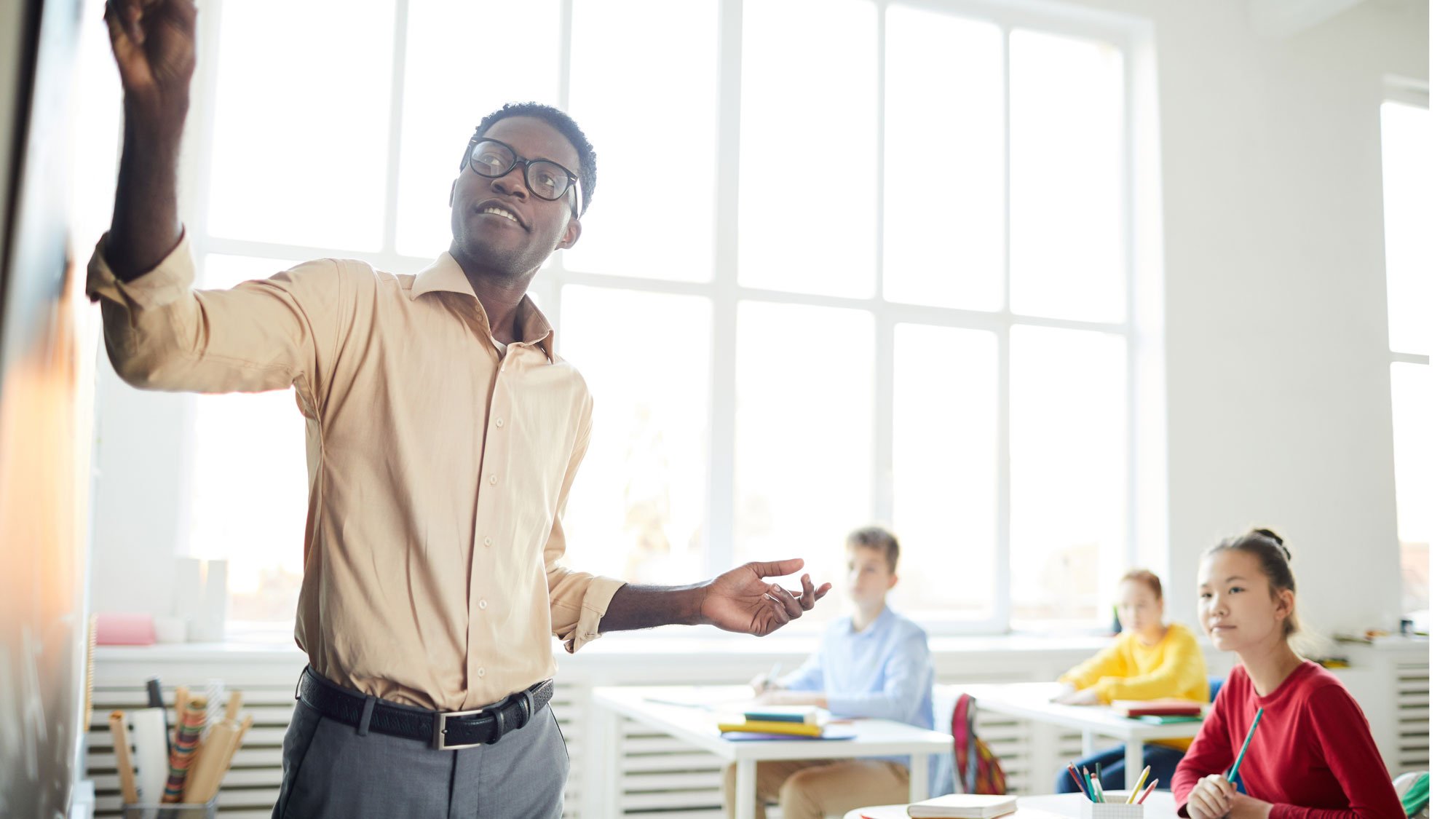 teacher-writing-on-whiteboard